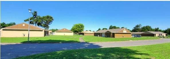 Seminole Village Apartments in Osceola, Arkansas — residential buildings and green grounds